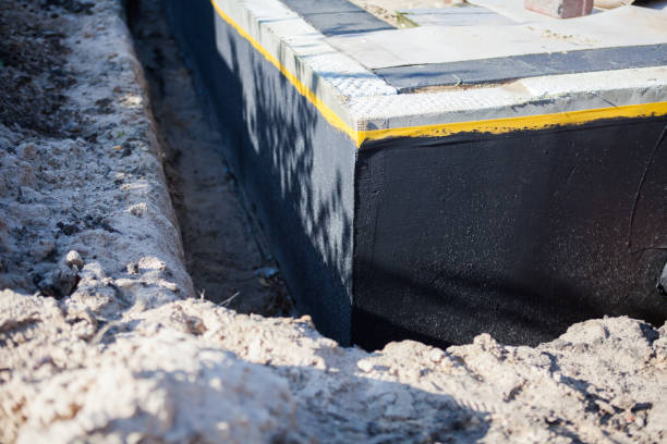 Professional Basement Waterproofing technician working in Washington, NC